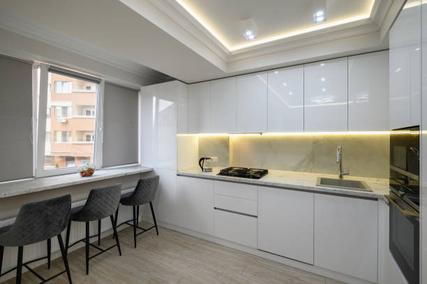 istock Interior of a modern white kitchen in a luxury studio apartmen 1452231811