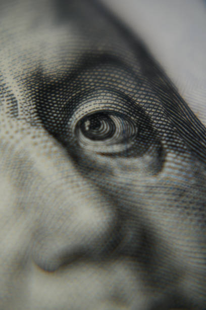 istock Close up shot of Benjamin Franklin's face on a hundred dollar banknote. 1452232630