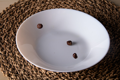 photo several cereal balls lies in a deep white plate