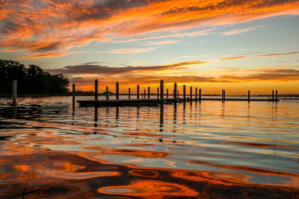 Fiery sunset over waves at Lake Dora in Mount Dora, Florida stock photo