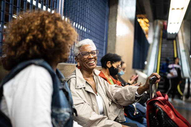 istock Senior friends talking while waiting in the subway 1452233715