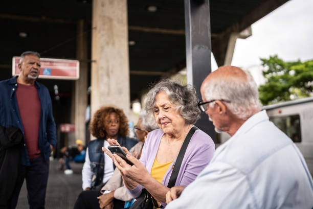 istock Senior couple using the mobile phone in a subway station 1452234243