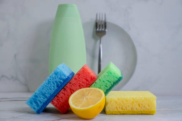 istock Bottle of dish detergent, lemon, sponge on a light background 1452234517