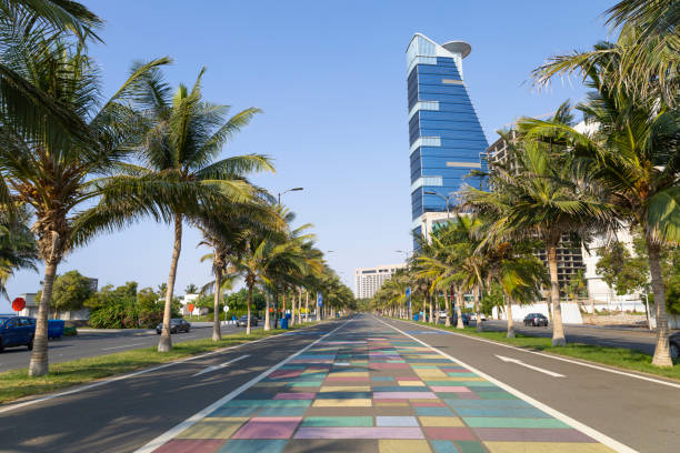 Jeddah, Saudi Arabia - colorful running track of jeddah waterfront Jeddah, Saudi Arabia - Dec 2 2022: nice weather for sport practicing in colorful running track of jeddah beach with palm tree jeddah stock pictures, royalty-free photos & images