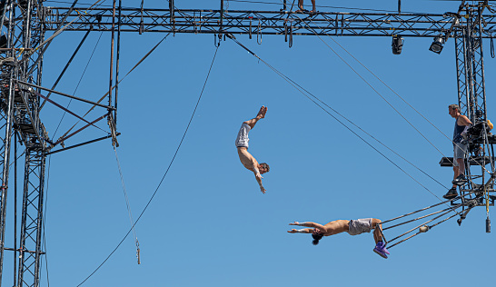 Sibiu City, Romania - 28 June 2022 trapeze artists acrobats from CirkVOST, on the metal scaffolding at the International Theatre Festival from Sibiu, Romania.