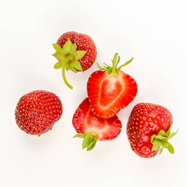 istock sliced freshly picked natural strawberries from the garden. highlighted on white. 1452235235