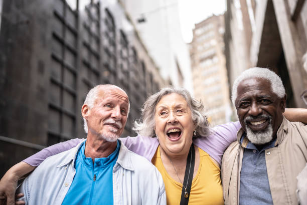 istock Senior tourists talking embraced outdoors 1452236641
