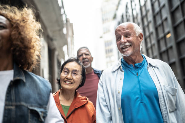 istock Senior friends talking while walk outdoors 1452240870