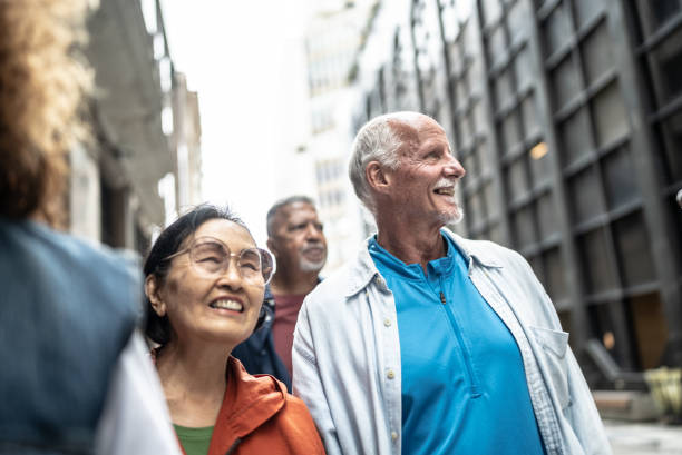 istock Senior tourists looking at view while walking outdoors 1452240871