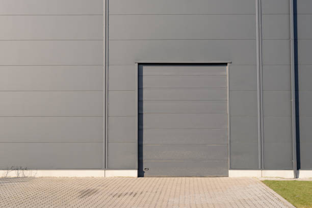 istock Closed grey metallic door of warehouse building 1452242338
