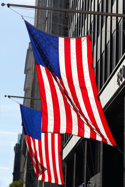 istock US flags in front of a building 1452244582