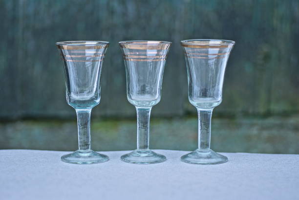 istock white brown three glass crystal goblets on a gray wooden table 1452245524