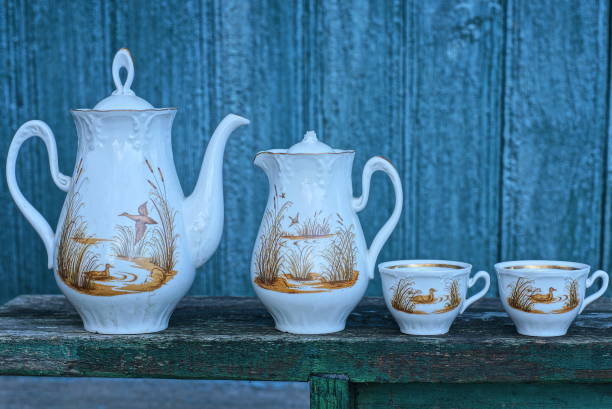 istock an old set of two white teapots and cups with a brown pattern 1452246098