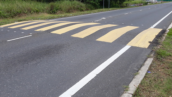 speed bumps on the road, to reduce traffic accidents