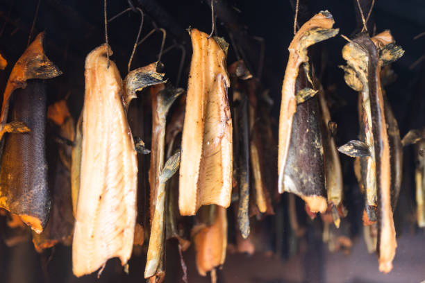 istock Smoked Salmon hanging in a smoking room 1452252448