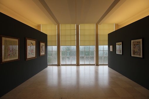 Porto, Portugal – August 17, 2022: An interior with hanging pictures and empty hall of modern art museum of Serralves, Portugal