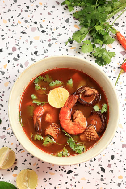 istock Top View Tom Yum Gung with Prawn, Squid, and Mushroom 1452260271