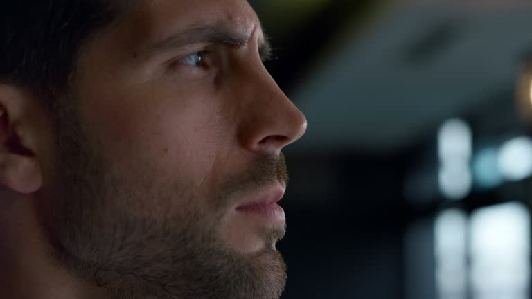 Closeup thoughtful businessman looking away in cafe. Serious decision concept