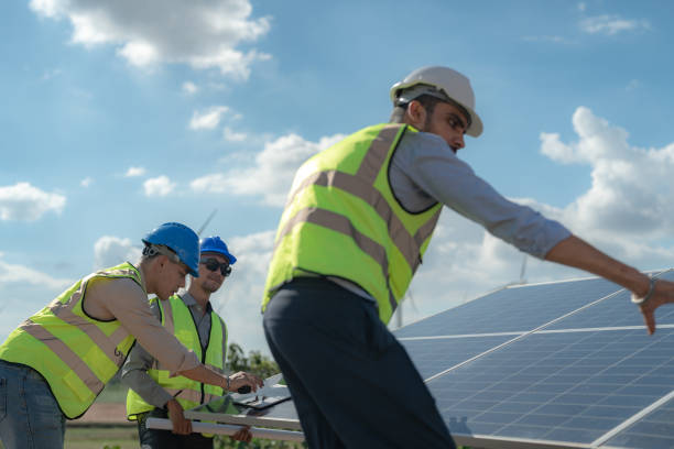 istock engineer man inspects construction of solar cell panel or photovoltaic cell by electronic device. Industrial Renewable energy of green power. factory worker working on tower roof. 1452280200