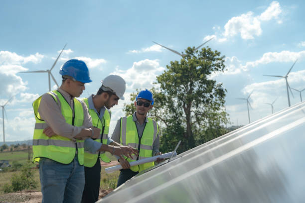 istock engineer man inspects construction of solar cell panel or photovoltaic cell by electronic device. Industrial Renewable energy of green power. factory worker working on tower roof. 1452288665