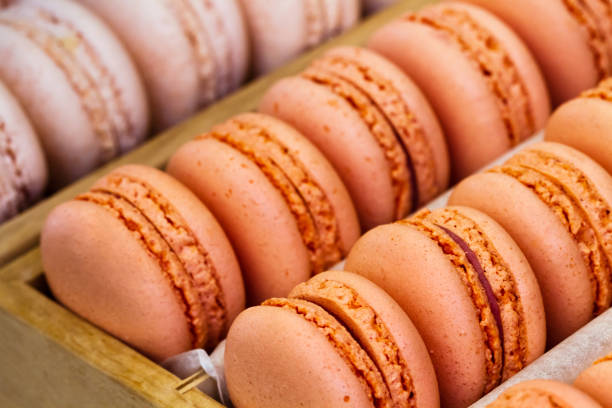 istock Colorful macarons in a rows in wooden box 1452292979