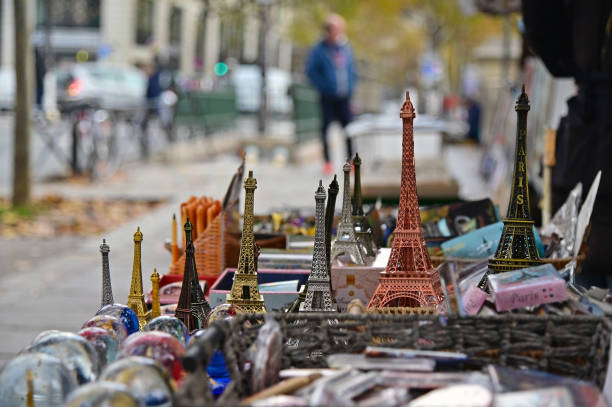 Souvenirs in a shop stand in Paris, France.