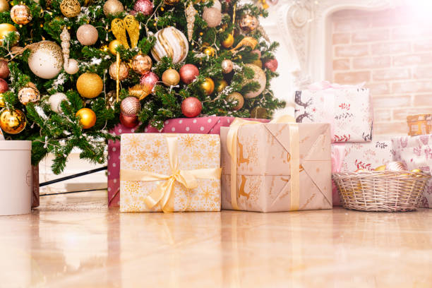 istock boxes with gifts on the Christmas tree with classic decorations. 1452296051