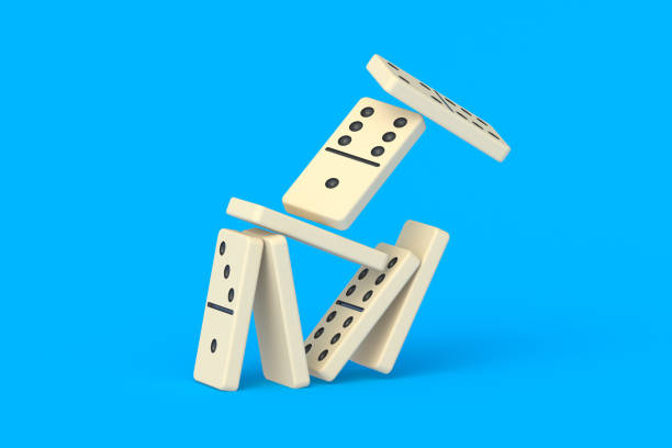 istock Falling domino tiles on blue background. Board game. Entertainment for leisure. 3d render 1452299983
