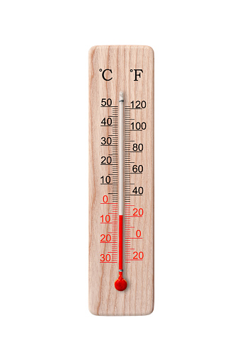Wooden celsius and fahrenheit scale thermometer isolated on a white background. Ambient temperature 6 degrees