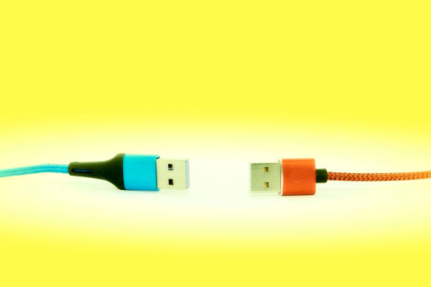 istock Blue red Universal Serial Bus cables isolated on yellow background 1452310166