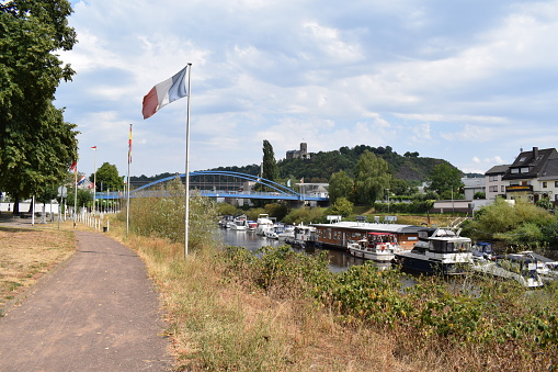 Lahnstein, Germany - 07/25/2022: path along the Lahn with ships