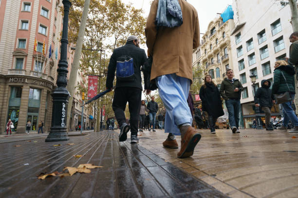 People walk on the tourist street in the Barcelona stock photo