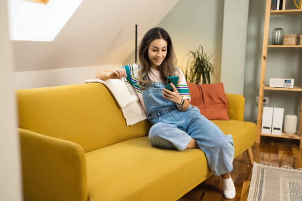 istock Girl having fun online at home 1452316497