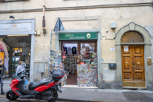 People walking past Boboli Souvenir Shop in Florence at Tuscany, Italy. It is named for the nearby Boboli Gardens.