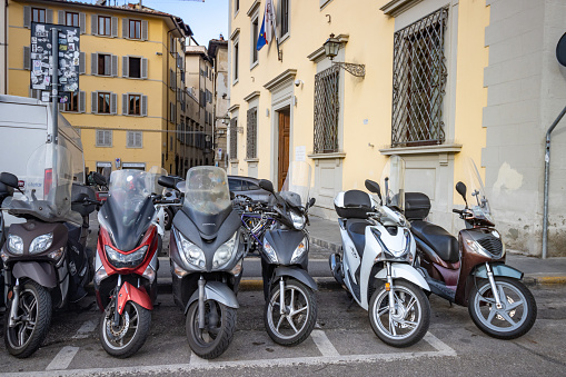 Motorcycles in Florence at Tuscany, Italy, with manufacturer model names visible.