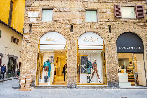 Luisa Spagnoli Womenswear on Via dei Calzaiuoli in Florence at Tuscany, Italy, with people visible.
