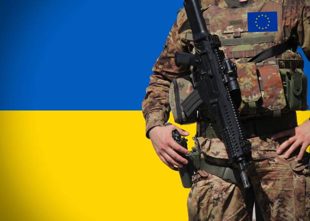 istock Ukrainian flag with an European Soldier as background . 1452319002