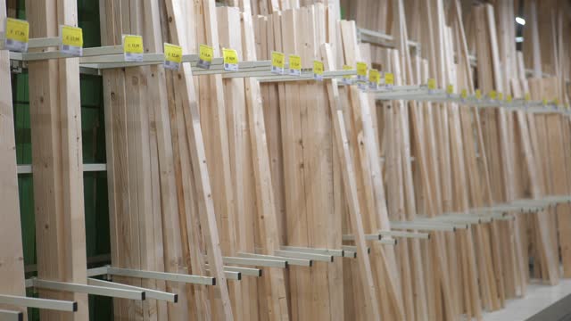 Planks of timber wood in carpentry store warehouse