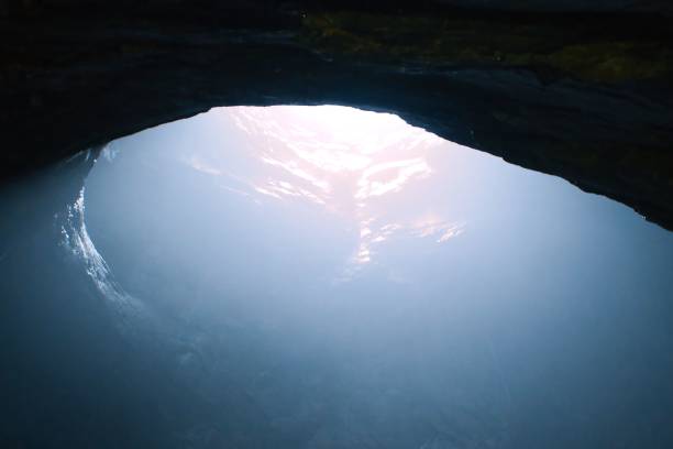 istock Rays of sunlight into the underwater cave 1452320261