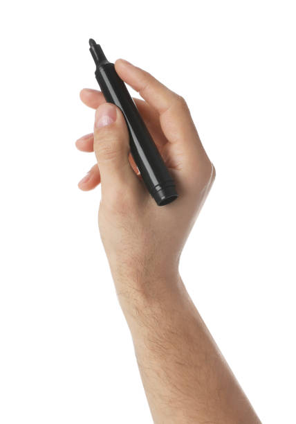 istock Man holding black marker on white background, closeup 1452320481