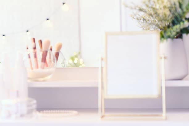 istock Table mirror on dressing table with make up accessories. Self-Care. White, pastel interior. Blurred backgraund 1452320590