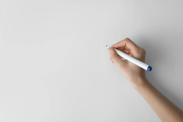 istock Woman holding color marker on white background, top view 1452320640