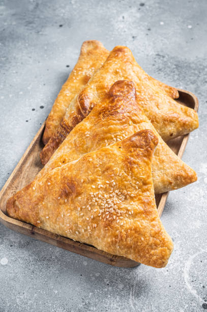 istock Samosa, samsa meat stuffed oriental pies. Gray background. Top view 1452323059