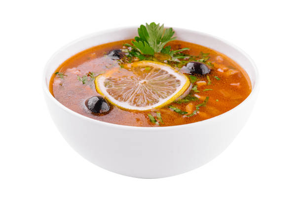 istock meat soup Solyanka in bowl on white 1452323363