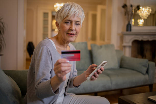 istock Cheerful  woman doing online shopping 1452325147
