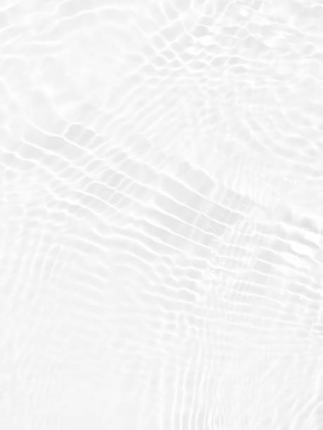 istock Defocus blurred transparent white colored clear calm water surface texture with splashes and bubbles. Trendy abstract nature background. Water waves in sunlight with copy space. White water shine 1452326116