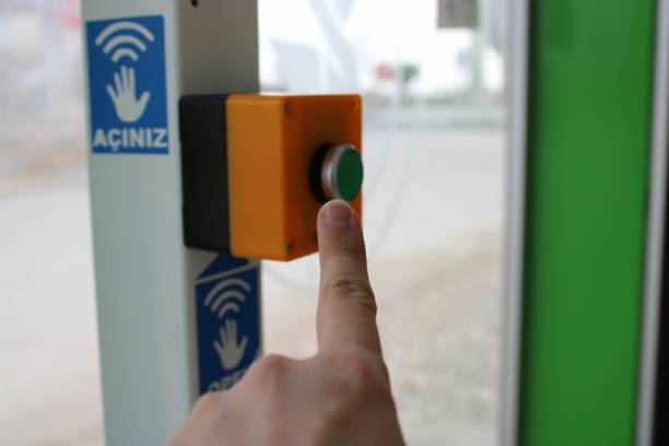 istock A male hand pressing a red button. fire and emergency notification. button to open the bus stop door. 1452326731