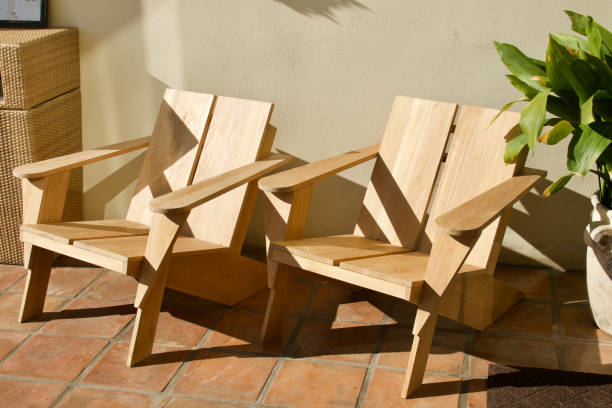 istock Modern Adirondack style chairs on a sunny patio 1452326878