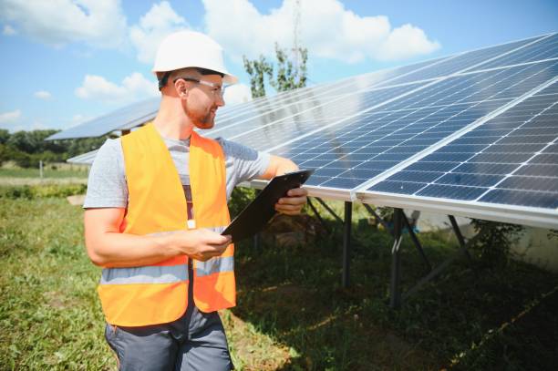 istock Male engineer in protective helmet installing solar photovoltaic panel system. Alternative energy ecological concept. 1452327103
