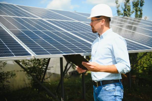 istock Engineer at solar power station with solar panel. Practical lessons on renewable energy power plants. 1452327791